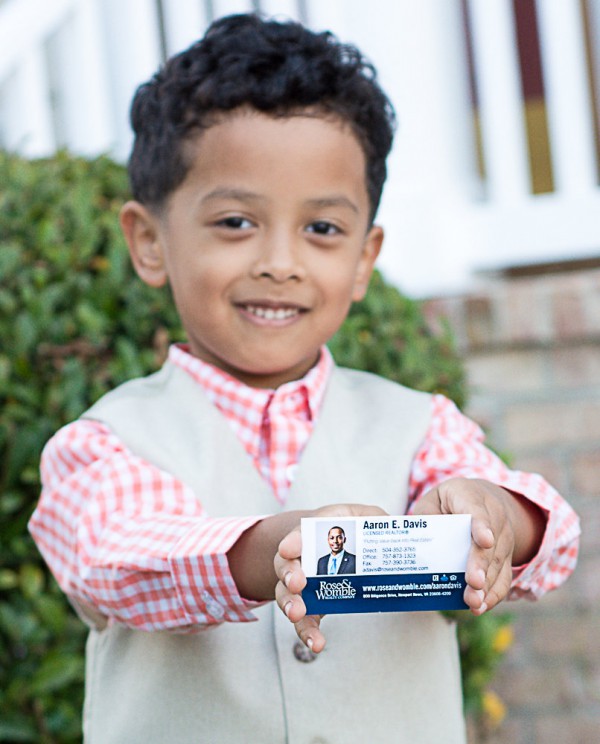 Little Aaron Davis shows off his dad's business card.  